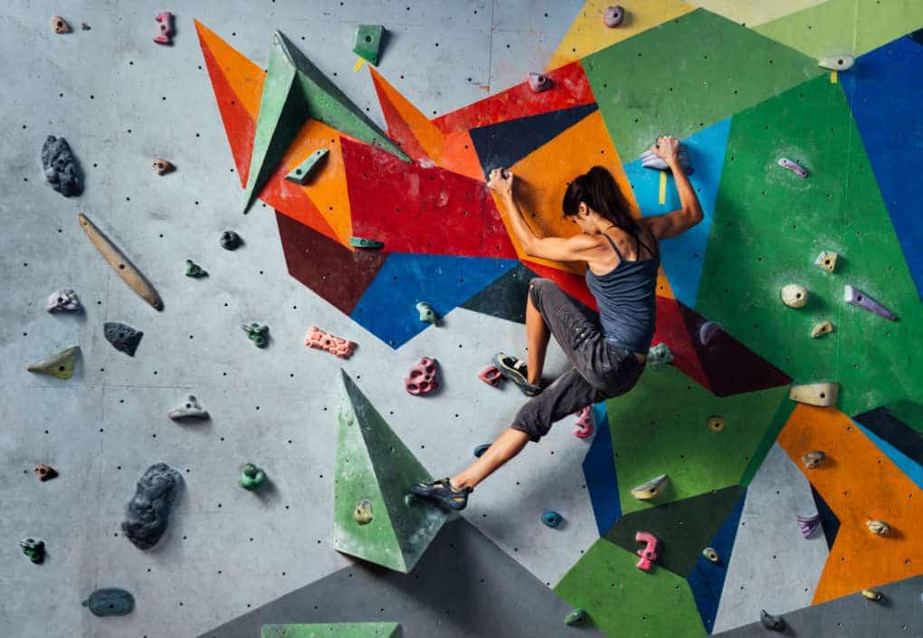 girl climbing on the wall